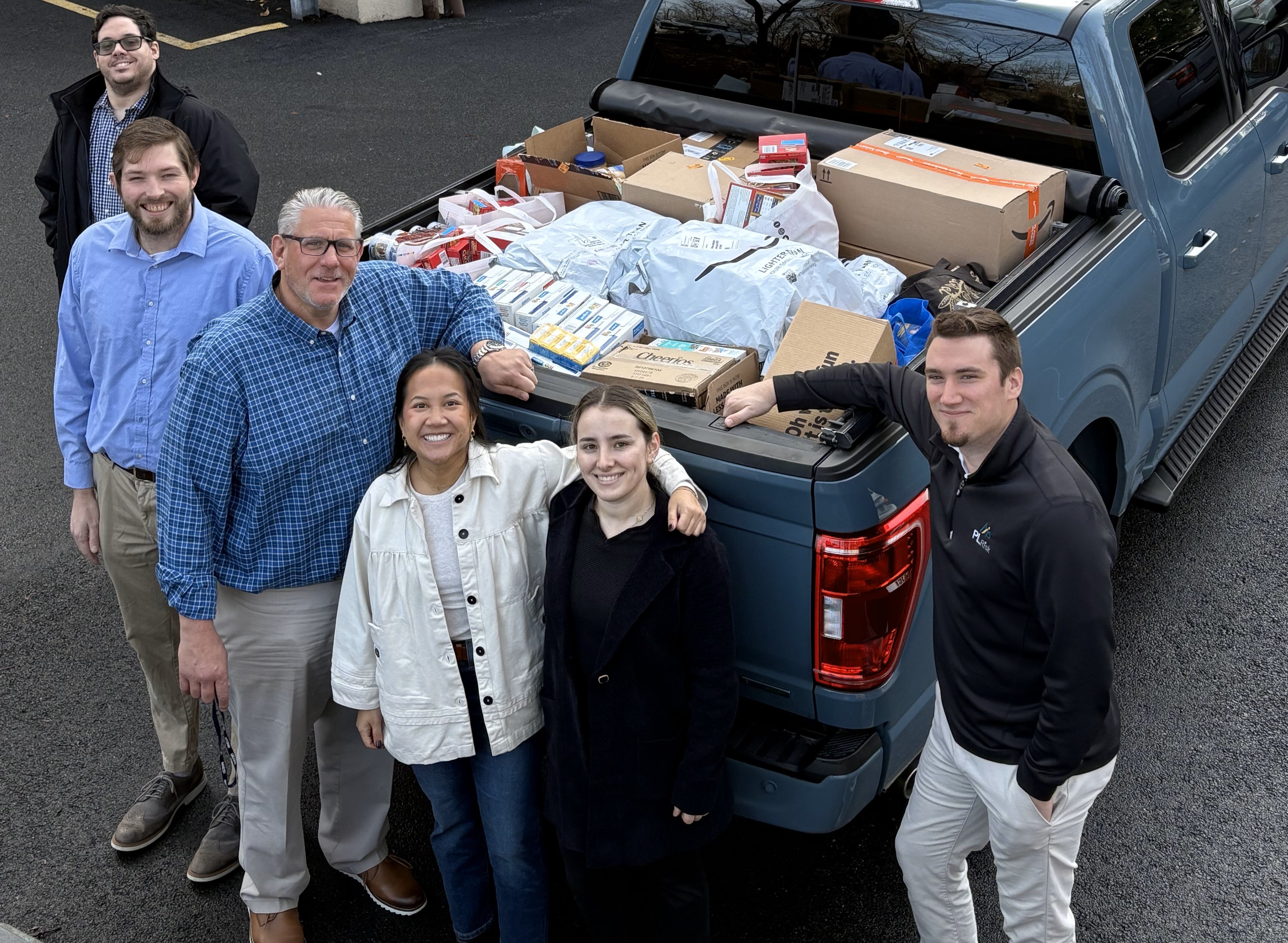 Axis Insurance Services holds food drive for  CUMAC